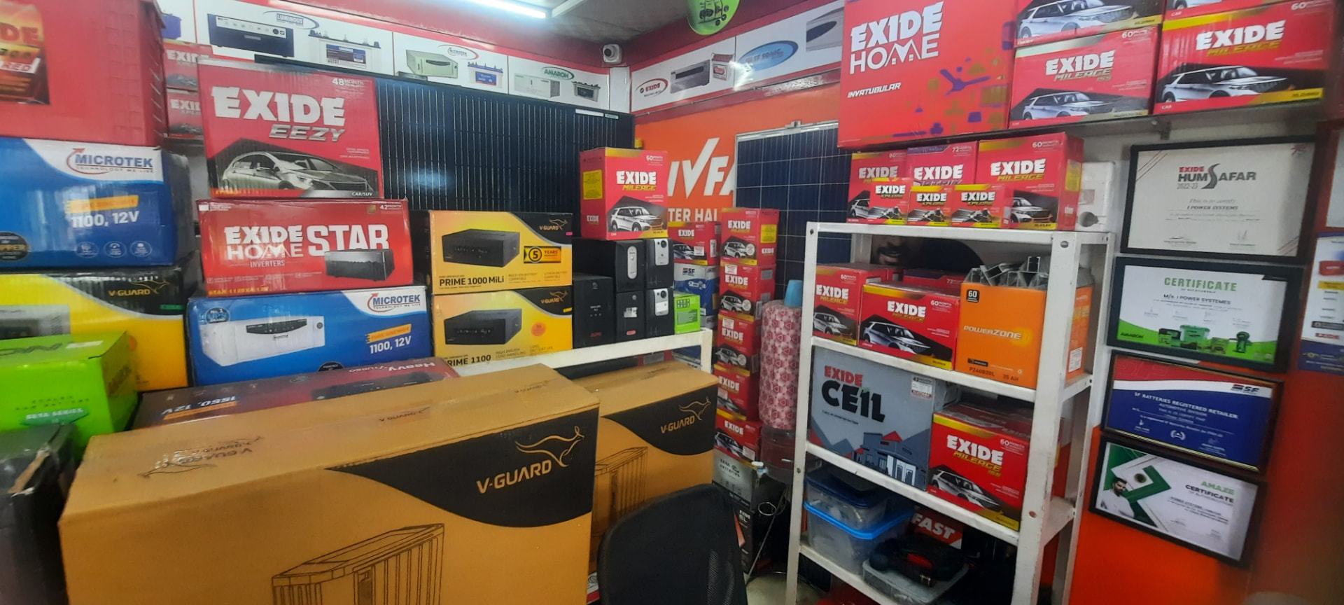 Inverters, UPS units and solar panels on display inside the shop