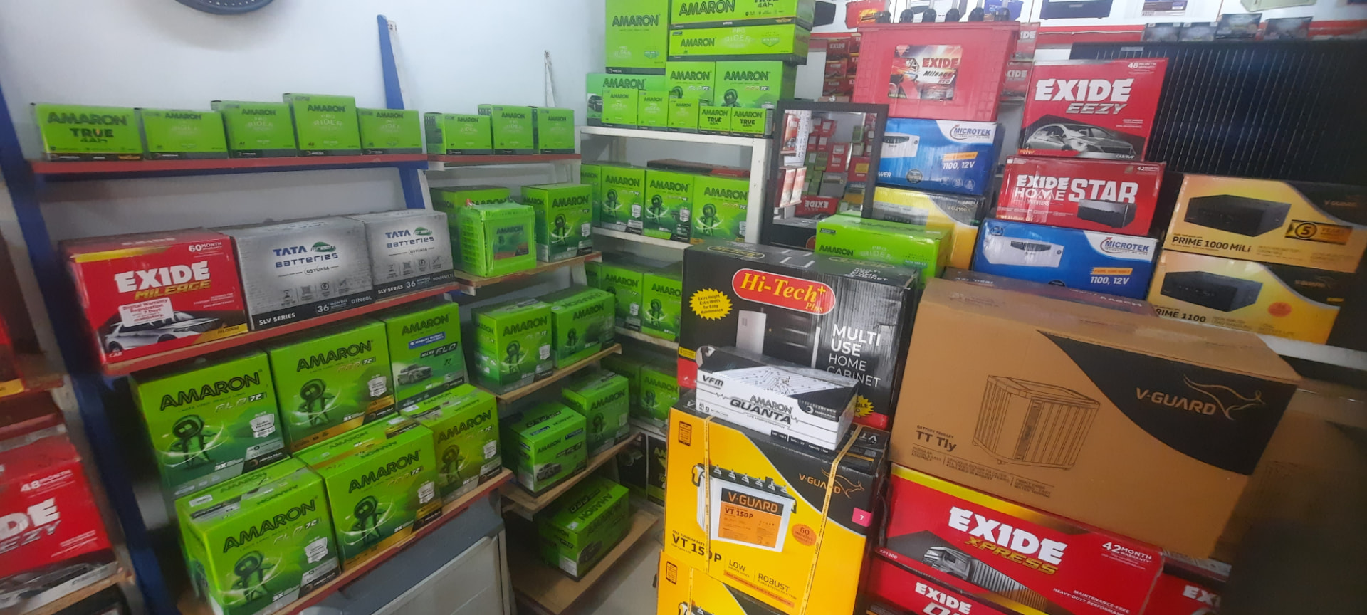 Shelves of branded inverter and vehicle batteries inside the shop